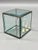 A fine faceted crystal glass panel display cube. Circa 1980-90. The bottom is mirrored glass and the top flips back to...