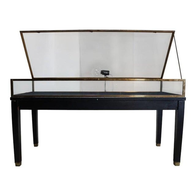 Presenting an elegant pair of antique display cases by Russel Built (Ilion, NY), meticulously crafted around circa 1920,...