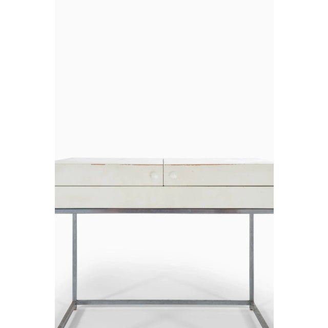 - Side table in steel and white lacquered wood - Designed by Poul Nørreklit - Produced by Selectform in Denmark - Made in...