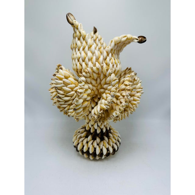 This large vintage piece is made of shells but shaped like a vase and flower! So pretty, so unique!