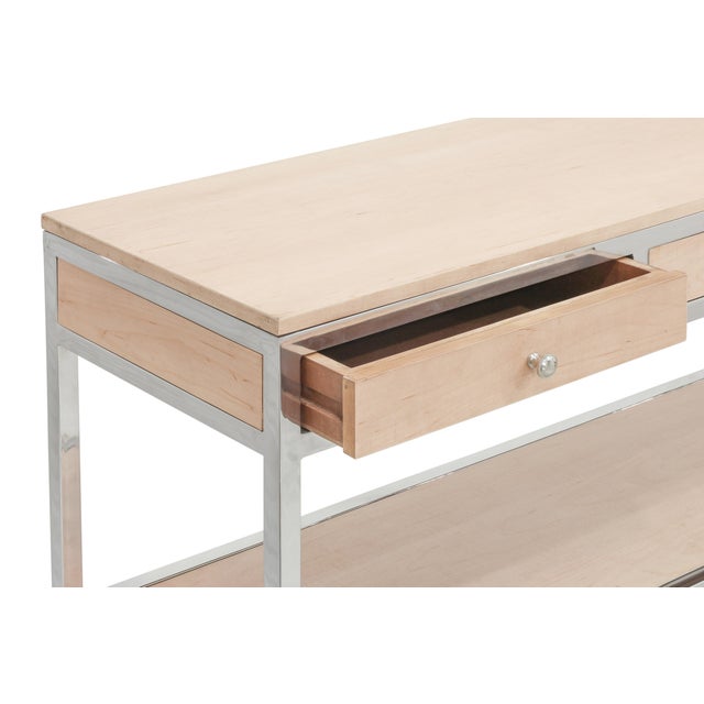 The Oren Console blends Natural Ash oak with stainless steel accents for a sharp mid century modern statement. Its angular...