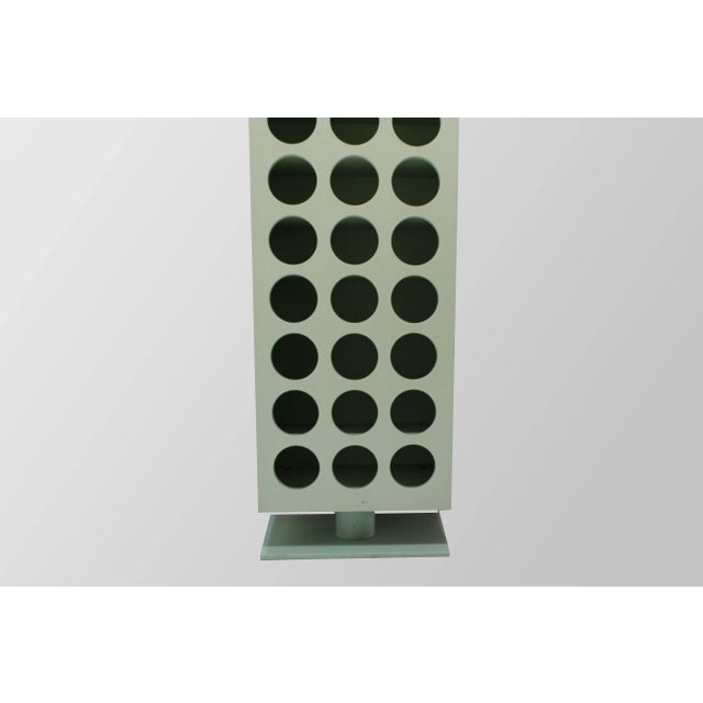 This is the Bacco totem by Massimo Mariani for Meccani Arredamenti, 1990. It is in lacquered wood with painted metal base...