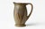 This French Art Deco pitcher by Denbac features stylized reliefs in a soft sage-green glaze. Its sculptural handle and...