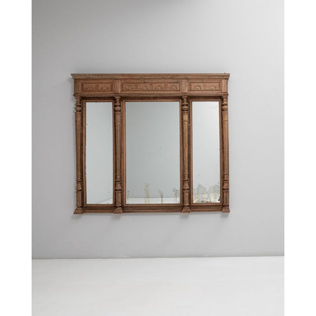 Carved oak triptych mirror in Warm Golden Oak. Its warm golden oak finish sets off three arched panels, carved cornice,...