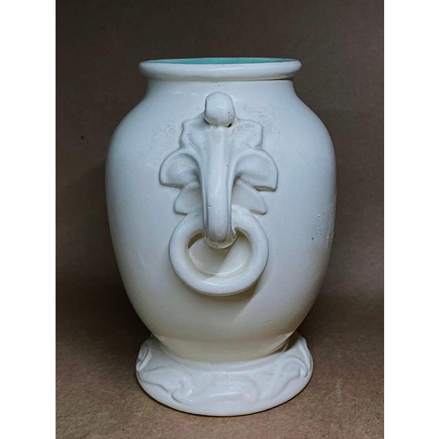 4.5" base, 3.5" mouth, 7.5" overall width, 7" height. George Rumrill designed and Red Wing Pottery made this Art Nouveau...