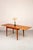 A beautiful Danish teak dining table designed by Svend Aage Madsen. The rounded corners and softly shaped edges give the...