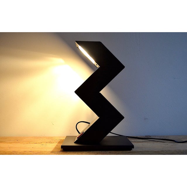 Zigzag / modular table lamp by designer shui l. D. Chan from 1984. By rotating the individual modules, the shape/position...