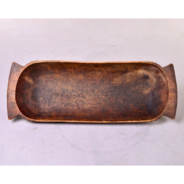 Circa 1930s extra large hand carved Eastern European wooden dough bowl. Dark wood with handles - this is 44” wide. Unknown...