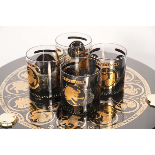 Manufacturer: Attributed to Federal Glass Origin: USA Materials: Glass, wood Condition: Some tabletop wear, in excellent...