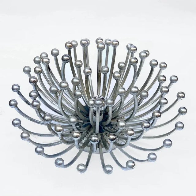 Magnificent mid-century chromed abs plastic "pistillo" table or chandelier. This amazing piece was designed in 1969 by...
