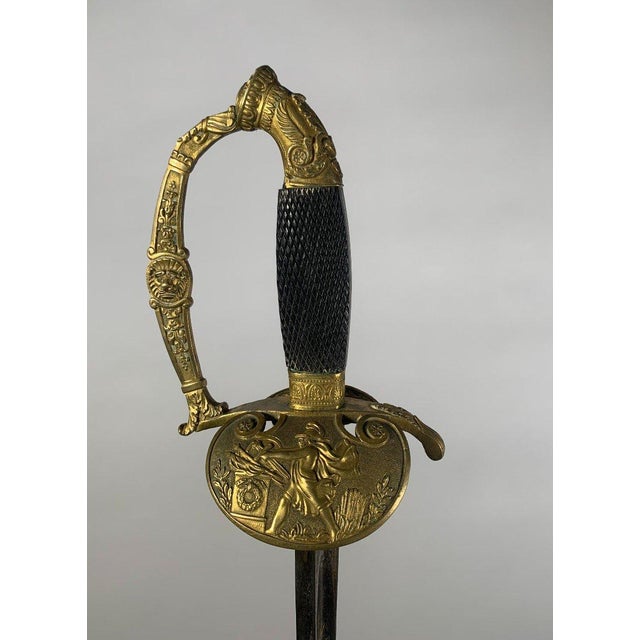 Sword of a senior officer or high-ranking official, Empire period. Gilt bronze hilt, molded branch with a lion's head in...