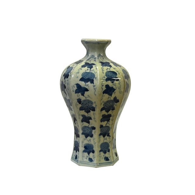 This is a Chinese decorative porcelain vase in Blue and White color finish. It is in small octagonal shape. Dimensions:...