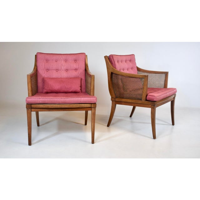 Stunning pair of Mid Century Modern swag caned arm lounge chairs by Erwin Lambeth, designed and manufactured by John...