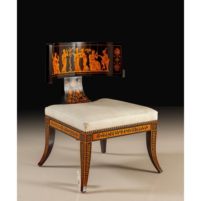 This striking Neoclassical chair pairs a deep ebony finish with finely executed contrasting inlays inspired by classical...