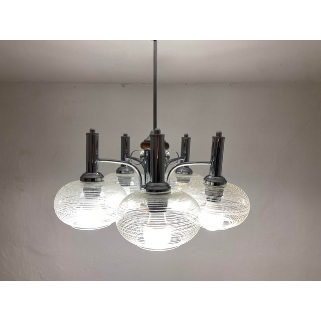This original five-light chandelier was manufactured by emi poljčane in slovenia, then part of yugoslavia, and dates to...