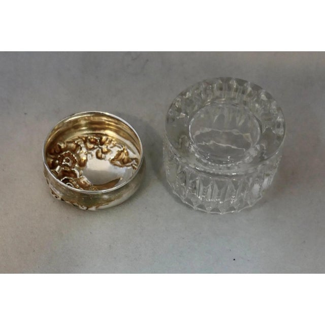 This charming early 20th century miniature vanity jar is beautifully designed with a stunning sterling silver lid cover...