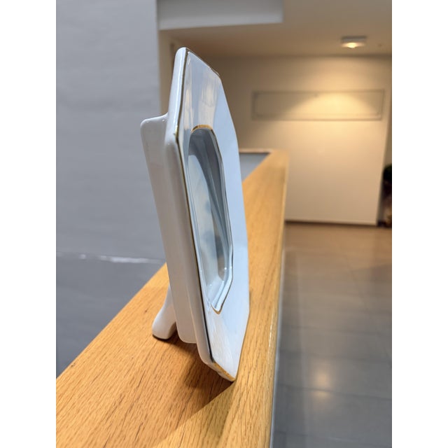 Elegant photo frame attributed to Italian designer Tommaso Barbi, known for his refined and sophisticated decorative...