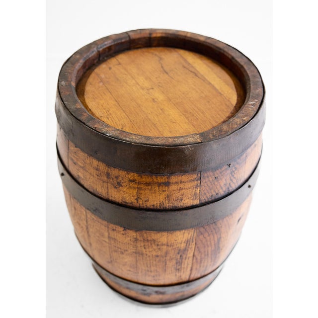 A handsome and well-proportioned antique coopered barrel in oak with original iron hooping, dating to the 19th century and...