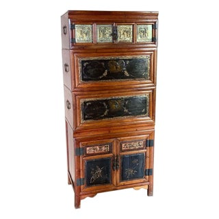 Vintage Asian Chinoiserie Lacquered Wood Tall Cabinet With Brass Decorative Panels For Sale
