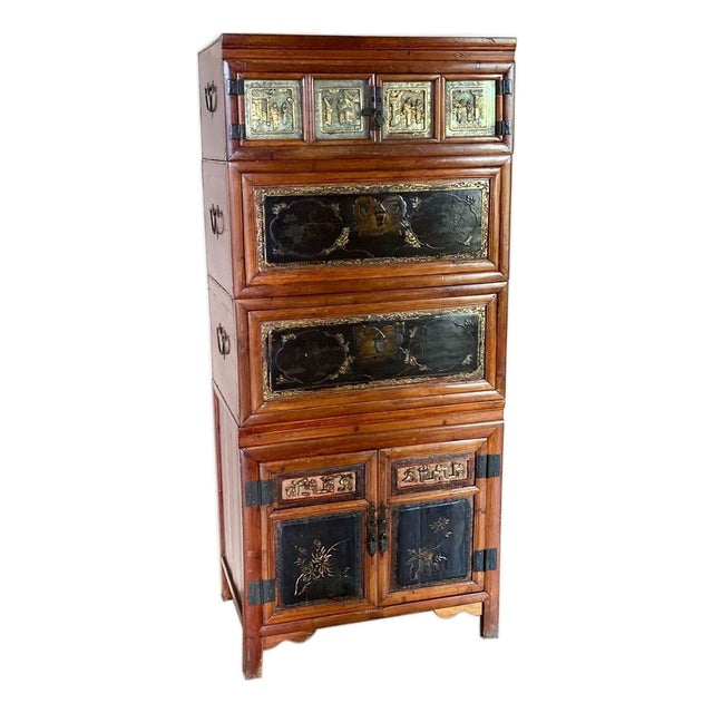 Vintage Asian Chinoiserie Lacquered Wood Tall Cabinet With Brass Decorative Panels For Sale