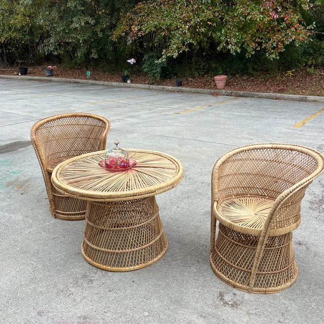 Up for consideration is a beautiful vintage rattan wicker side chairs and matching table. This set would look lovely in...