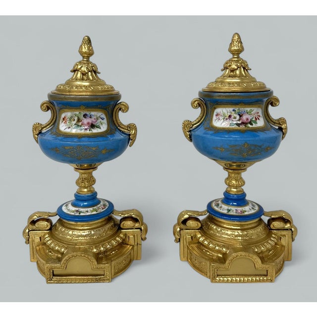 Stunning Pair of French Sevres Soft Paste Enameled Porcelain and Ormolu Twin Handle Table or Mantle Urns of traditional...