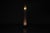 "Adubai" floor lamp. It rests on a cylindrical steel base adorned with seven opal glass panels of varying sizes. It is...