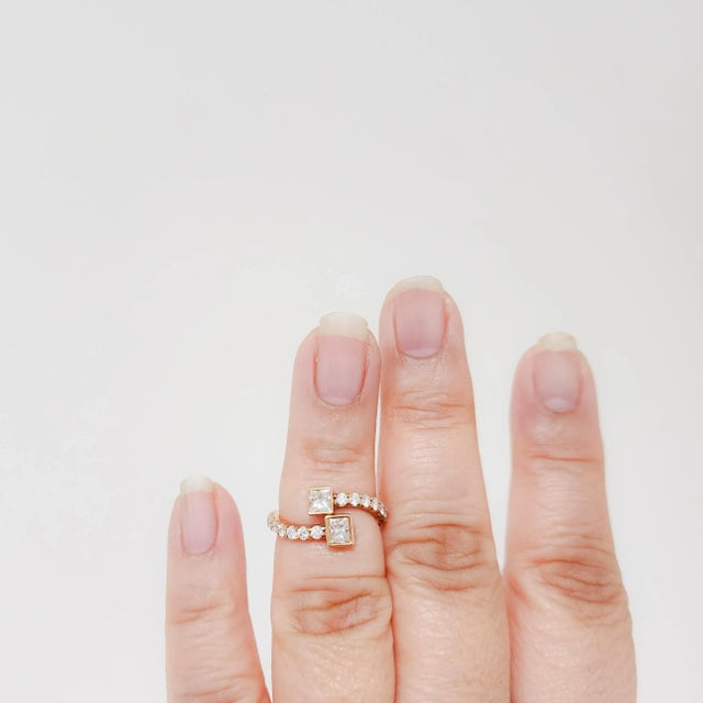 Beautiful 1.30 ct. white diamond princess cuts and rounds. Handmade in 18k rose gold. Ring size 5.25. Metal: Rose Gold...
