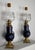Petroleum lamps in cobalt blue earthenware, embellished with bronze and adorned with original globes with flower and leaf...