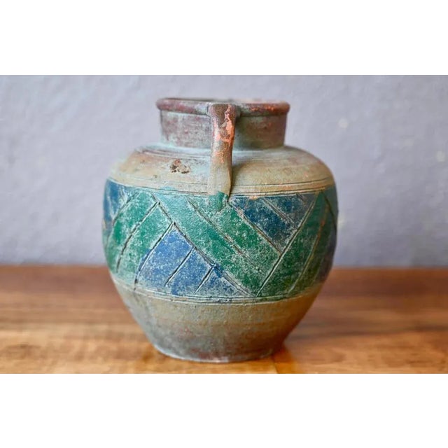 This small vintage vase is inspired by traditional Mediterranean ceramics productions. Partially enamelled, it has a...