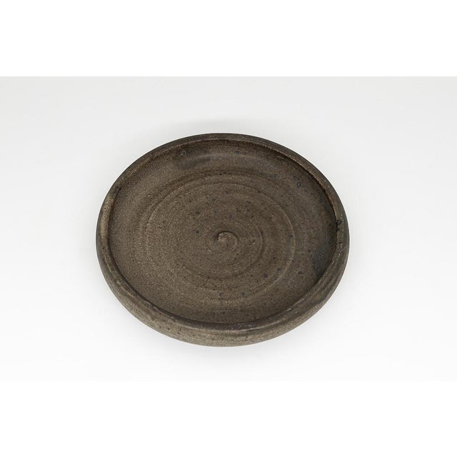 This exceptional early 20th-century Danish studio pottery bowl is a rare collectible designed and handcrafted by the...