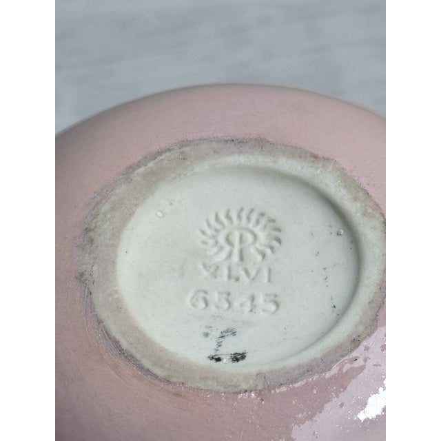 An authentic 1926 Rookwood Pottery cabinet vase, shape number 6545, executed in a soft matte blush glaze. This petite form...