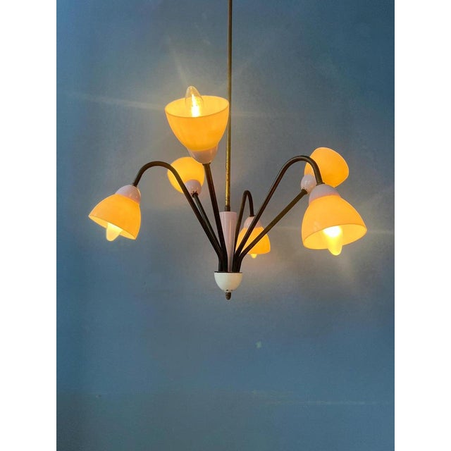 50s mid century 'spider' pendant lamp with lilac and beige colours. The lamp has six beige lights. The black frame...