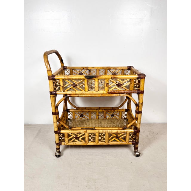 Vintage Brighton style bamboo rattan bar cart. Thick burnt bamboo frame with Brighton fretwork details and leather wrapped...