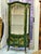 Make a dramatic statement with this exquisite Emerald Green Curio Cabinet, a luxurious display piece crafted with an...