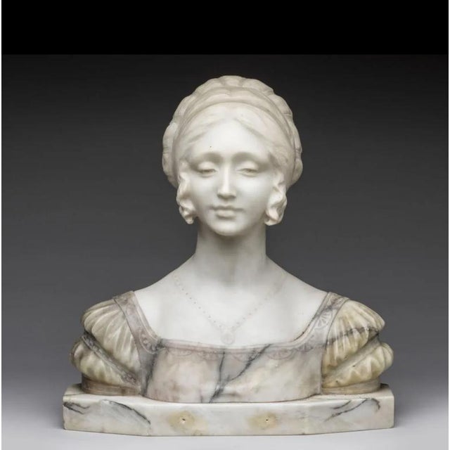 19th-Century Italian School "Bust of a Woman" in Carrara Marble, Signed This polychrome marble bust depicts a high-society...