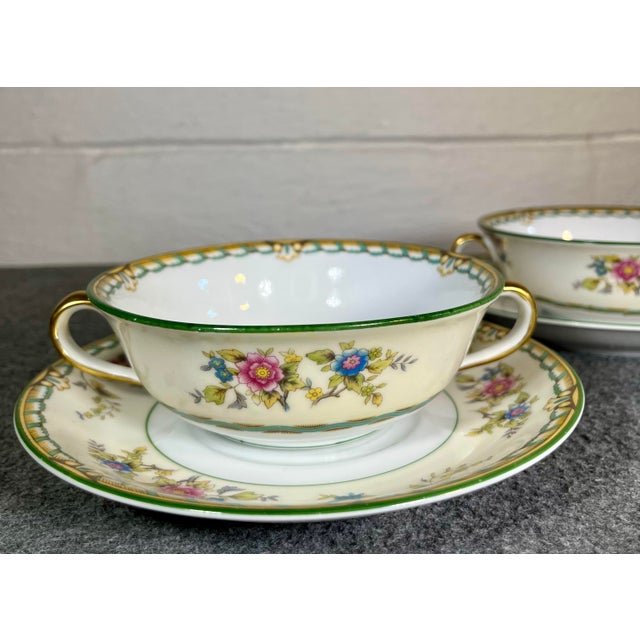 Multicolor floral with brown and green border. C. 1931. (2) Saucers- 6.75”L (2) Bowls- 6”L x 5”W x 1.75”H