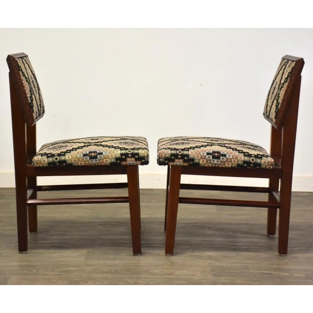 A pair of iconic mid century modern Taliesin dining chairs designed by Frank Lloyd Wright for Henredon Furniture. Seat...