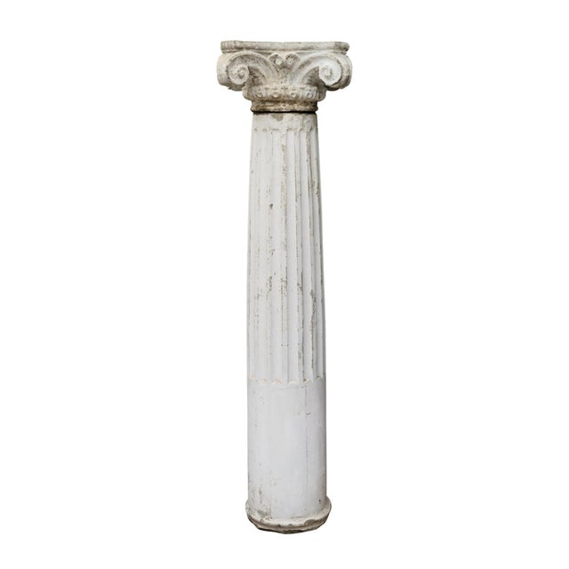 Column from France made of concrete and showcasing the original patina and painted finish. This fluted column is topped...