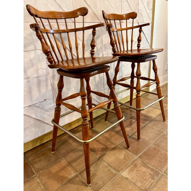 Late 20th Century Vintage Ethan Allen Heirloom Nutmeg Maple Colonial Early American Pub Style Swivel Barstool With Metal Footrest- A Pair For Sale - Image 5 of 12