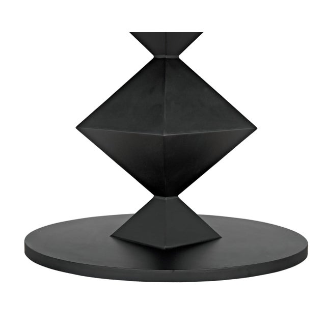 With a design pulled from inspirations from geometry and origami to cut gemstones, this contemporary oval dining table has...