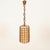 Marvelous and unique mid-century organic pendant entirely hand-crafted in curved rattan and hand-woven wicker, completed...