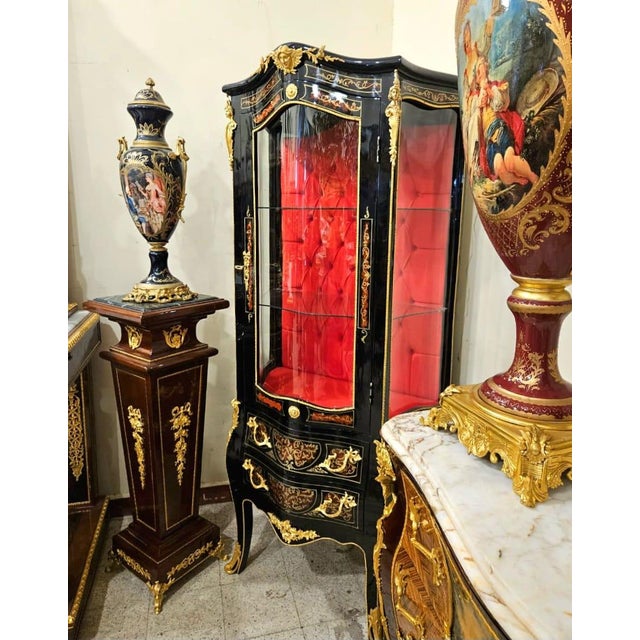 Showcase your most treasured collectibles in extraordinary style with this French Louis XV inspired display cabinet....