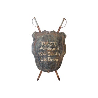 Large Metal Shield & Swords Antiques Store Sign For Sale