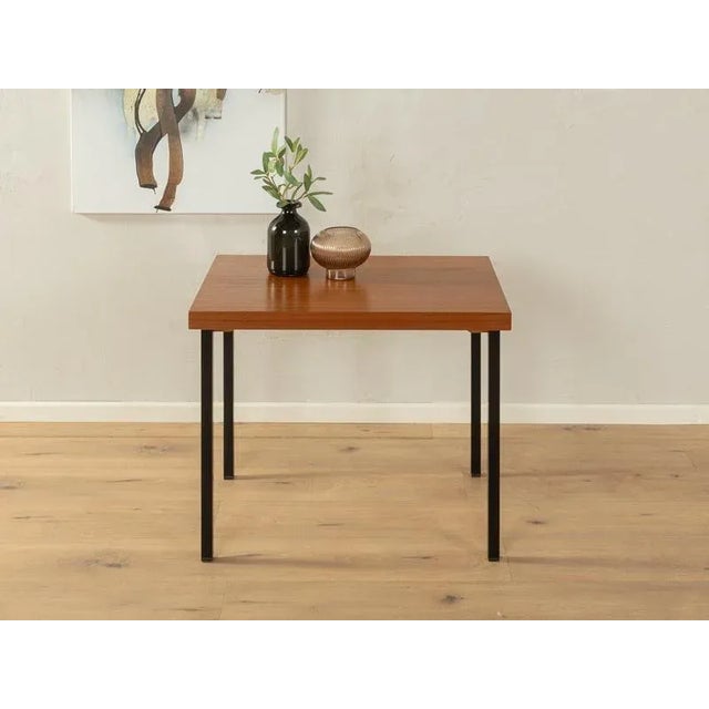 Coffee table from opal furniture from the 1960s. High -quality table top in teak veneer with square steel feet in...