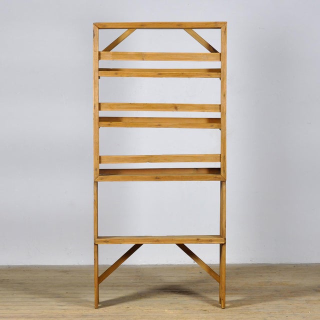 This open pine cabinet from circa 1930 is a charming and functional piece with a warm, authentic look. The cabinet...