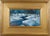 This oil on board painting captures a serene winter landscape, where a winding stream cuts through a blanket of snow. The...