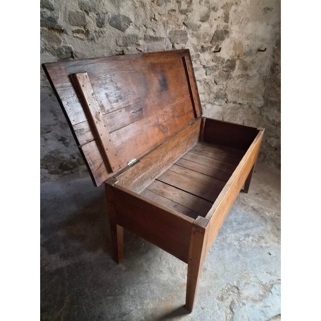 Antique French flour chest dating from the 19th century. Made from solid oak, the chest stands on four tapered legs and...