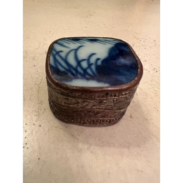 Unique Chinese trinket box made of porcelain and copper. The top of the box is a piece of porcelain from an antique vase...