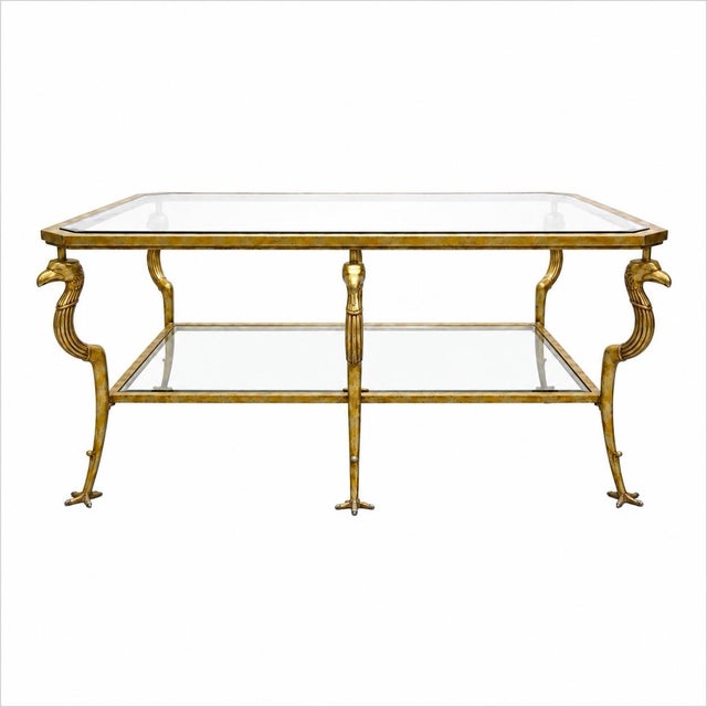 This is a French Maison Jansen inspired gilt metal eagle form two tiered glass top coffee table. I love the eagle and claw...